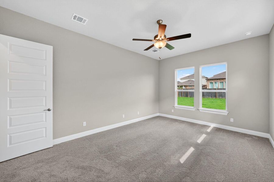 Spare room with light colored carpet and ceiling fan Spare room with light colored carpet and ceiling fan