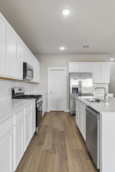 Kitchen in the Winters home plan by Trophy Signature Homes – REPRESENTATIVE PHOTO