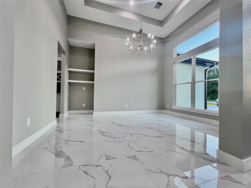 Grand formal dining has 13’ Ceiling with 14’ recessed Ceiling. Grand formal dining has 13’ Ceiling with 14’ recessed Ceiling.