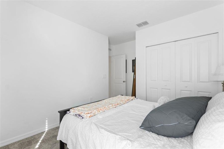 Furnished interior view inside a new home in Lawson Dunes: Estate Collection, Haines City (Image 9).