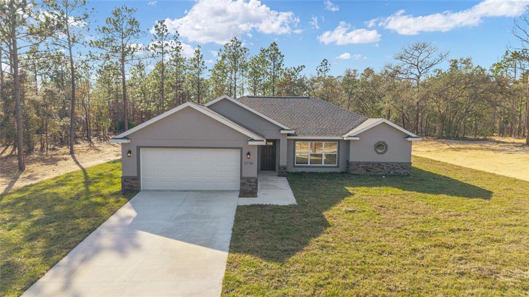 Front exterior of a new home in , Ocala, FL, highlighting curb appeal (Image 26). Front exterior of a new home in , Ocala, FL, highlighting curb appeal (Image 26).