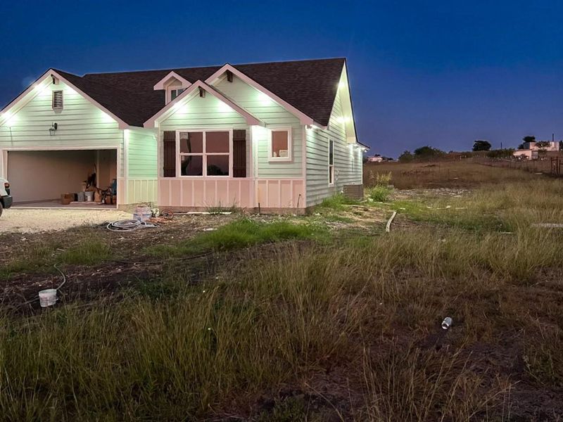 View of front of home featuring driveway and an attached garage