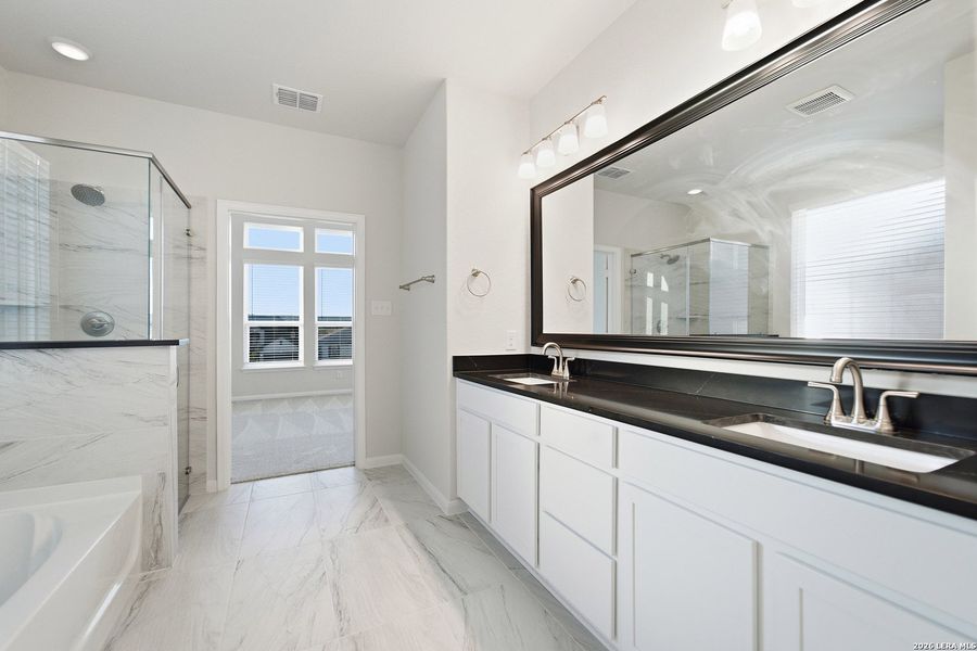 Furnished interior view inside a new home in The Woodlands at Medina Hills, Mico (Image 10).