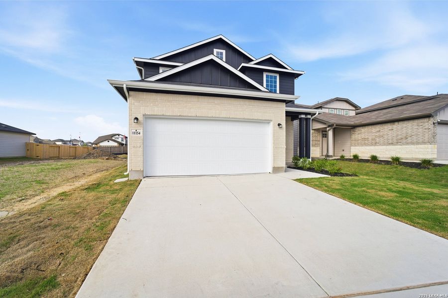 Front exterior of a new home in Katzer Ranch, Converse, TX, highlighting curb appeal (Image 21).