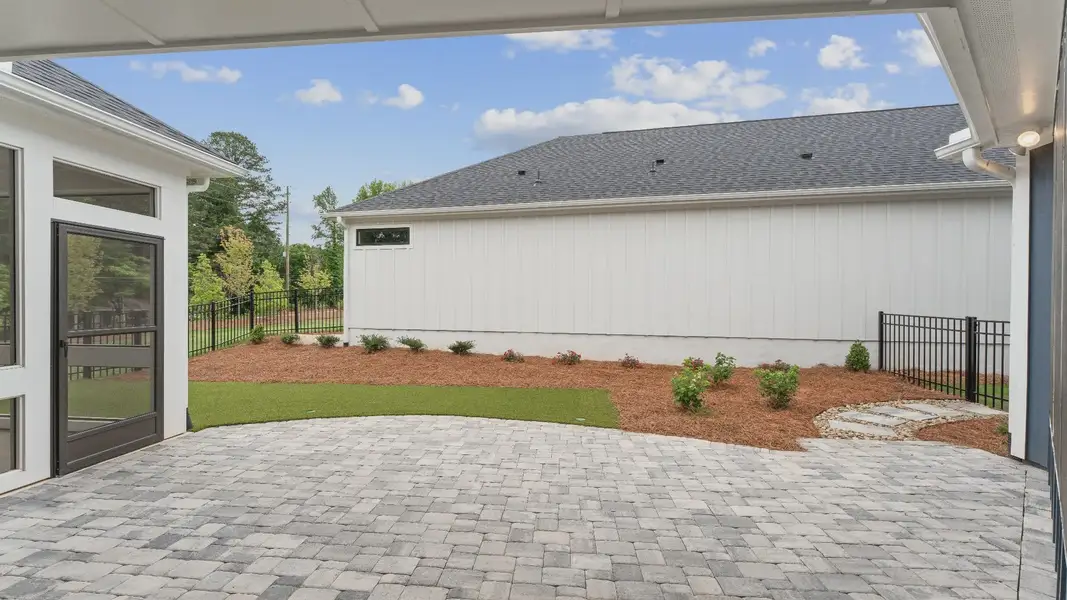 Exterior details and patio area of a home in The Courtyards at Redbud Lane, Canton (Image 4). Exterior details and patio area of a home in The Courtyards at Redbud Lane, Canton (Image 4).