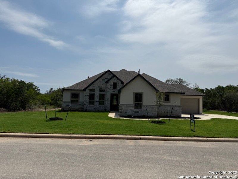 Front exterior of a new home in , Castroville, TX, highlighting curb appeal (Image 1). Front exterior of a new home in , Castroville, TX, highlighting curb appeal (Image 1).