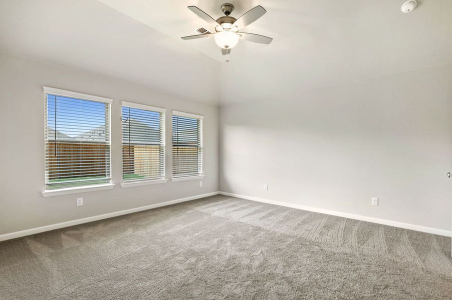 Primary Bedroom in the Quartz home plan by Trophy Signature Homes – REPRESENTATIVE PHOTO