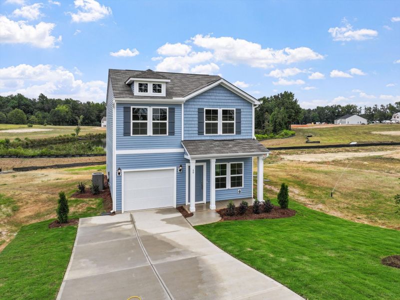 Front exterior of a new home in Cambridge Reserve, Angier, NC, highlighting curb appeal (Image 20).