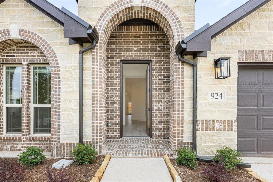 Front exterior of a new home in West Crossing, Anna, TX, highlighting curb appeal (Image 25). Front exterior of a new home in West Crossing, Anna, TX, highlighting curb appeal (Image 25).
