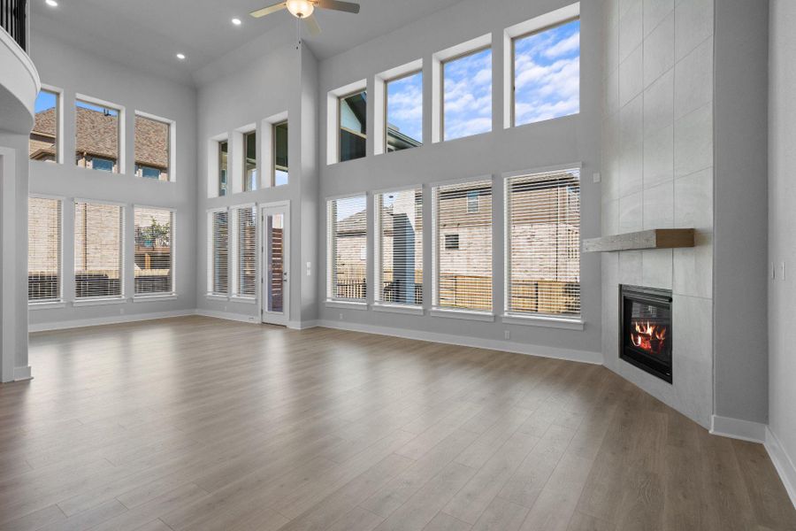 Family Room with soaring ceiling & fireplace