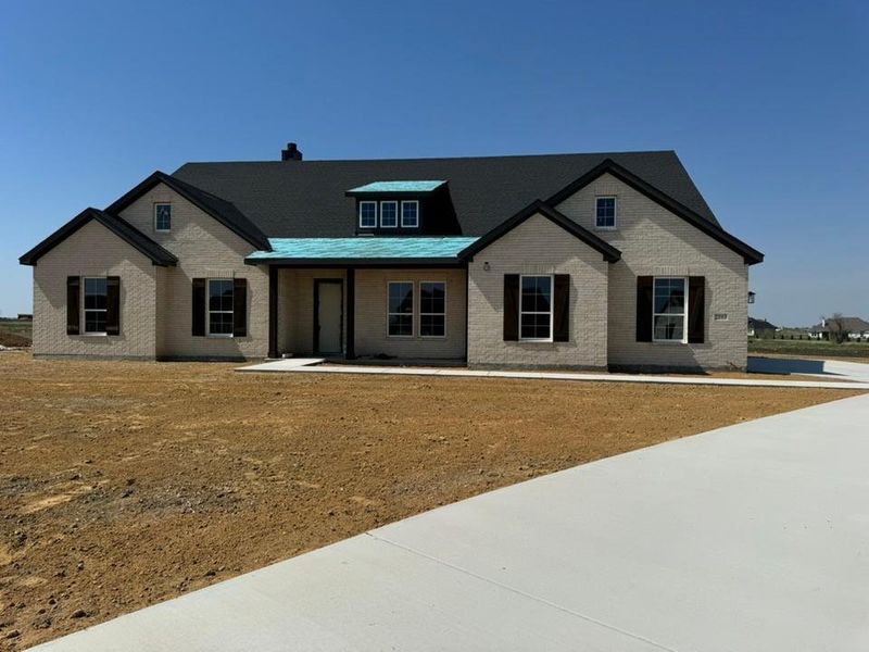 Front exterior of a new home in Rocky Top, Krum, TX, highlighting curb appeal (Image 11).