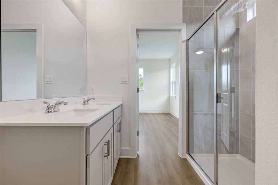 Double vanity and oversized shower.