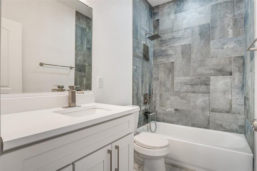 Bathroom featuring shower / tub combination and vanity Bathroom featuring shower / tub combination and vanity