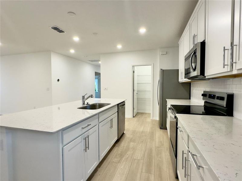 Furnished interior view inside a new home in Parkside Trails, Clermont (Image 10).