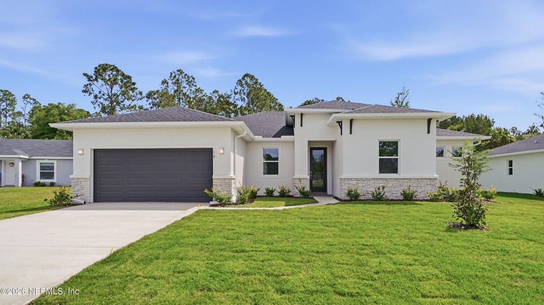 Front exterior of a new home in , Palm Coast, FL, highlighting curb appeal (Image 26).