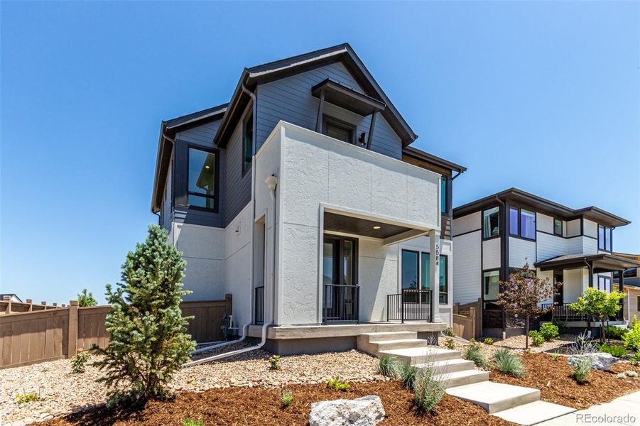 Front exterior of a new home in West Grange, Longmont, CO, highlighting curb appeal (Image 29).