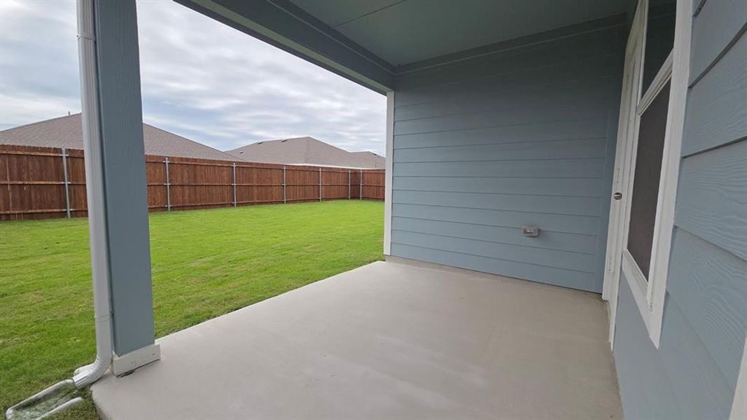 Covered patio featuring concrete flooring and a blue siding exterior