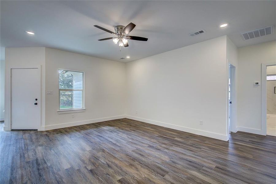 Unfurnished room with dark wood-style floors, recessed lighting, and ceiling fan Unfurnished room with dark wood-style floors, recessed lighting, and ceiling fan