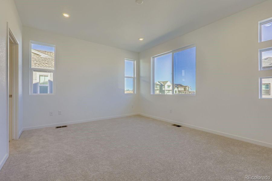 Spacious, unfurnished interior of a new home in Parterre: The Parkside Collection, Thornton (Image 11).