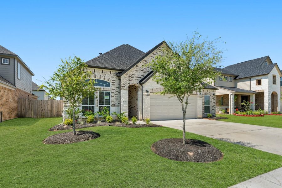 Front exterior of a new home in Briarwood Crossing, Rosenberg, TX, highlighting curb appeal (Image 18). Front exterior of a new home in Briarwood Crossing, Rosenberg, TX, highlighting curb appeal (Image 18).