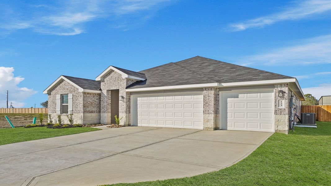 Front exterior of a new home in Medina, Dayton, TX, highlighting curb appeal (Image 2). Front exterior of a new home in Medina, Dayton, TX, highlighting curb appeal (Image 2).
