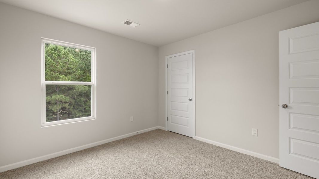 Spacious, unfurnished interior of a new home in Preserve at Dove Creek, Statham (Image 27).