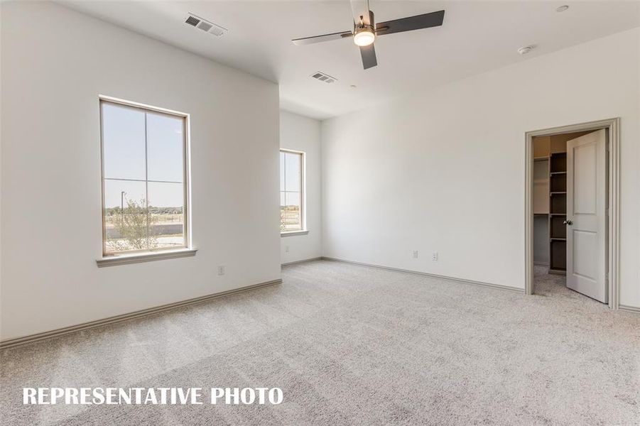 Oversized windows, a large walk in closet and reading nook are just a few of the designer touches found in this fantastic owner's suite.  REPRESENTATIVE PHOTO.