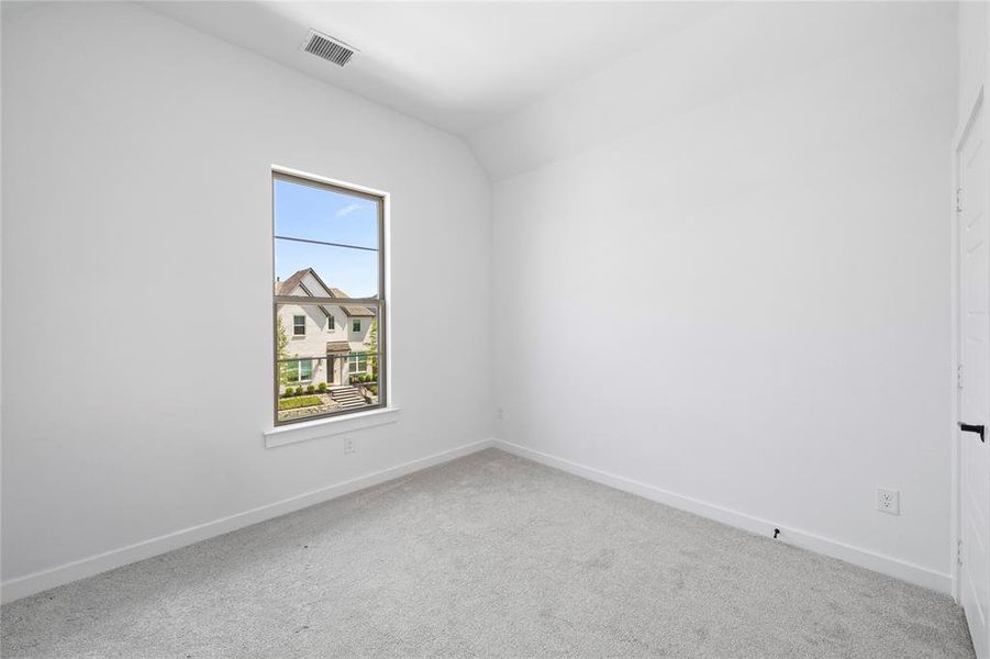 Neutral gray carpet flooring complements the white walls and trim