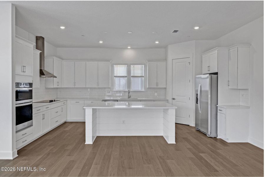 Furnished interior view inside a new home in North Beach Townhomes, Jacksonville Beach (Image 5).