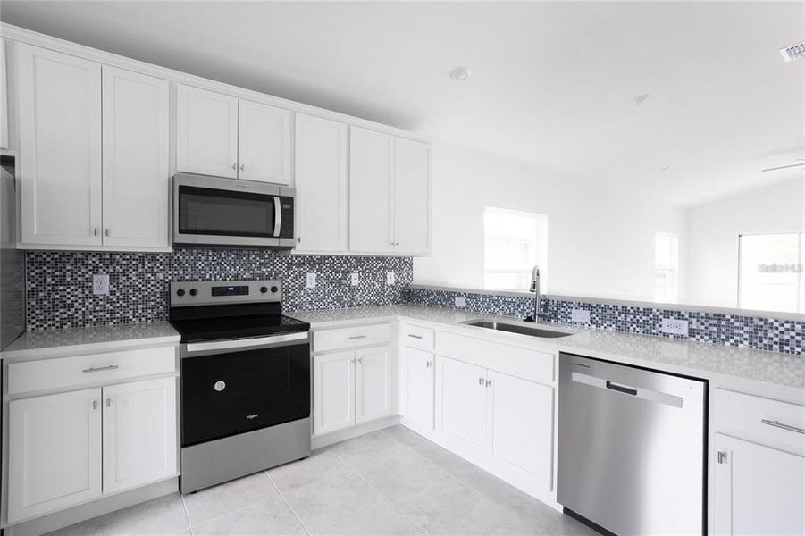 Furnished interior view inside a new home in , Port Charlotte (Image 11).