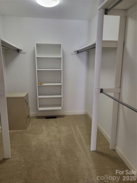 Spacious closet in primary bedroom on main level Spacious closet in primary bedroom on main level