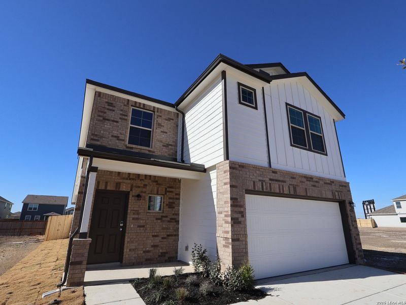 Front exterior of a new home in Park Place, New Braunfels, TX, highlighting curb appeal (Image 2). Front exterior of a new home in Park Place, New Braunfels, TX, highlighting curb appeal (Image 2).