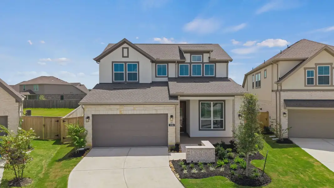 Front exterior of a new home in Lariat, Liberty Hill, TX, highlighting curb appeal (Image 1). Front exterior of a new home in Lariat, Liberty Hill, TX, highlighting curb appeal (Image 1).