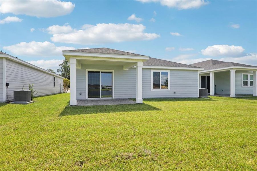 Exterior details and patio area of a home in Colbert Landings, Palm Coast (Image 3).