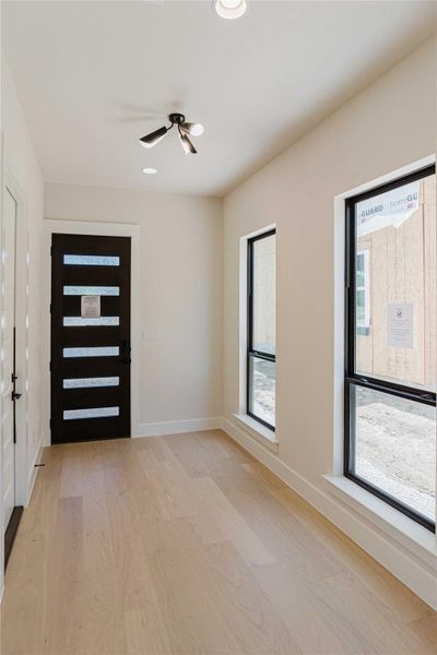 Foyer featuring light wood-type flooring and recessed lighting