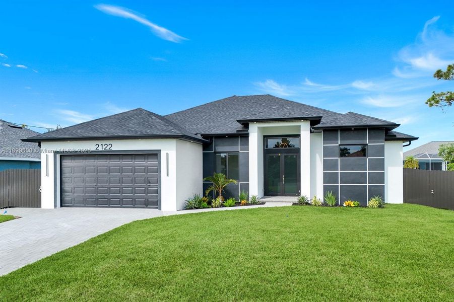Front exterior of a new home in , Cape Coral, FL, highlighting curb appeal (Image 1). Front exterior of a new home in , Cape Coral, FL, highlighting curb appeal (Image 1).