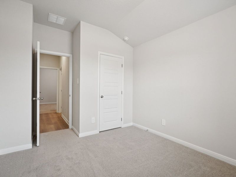 Guest bedroom in the Briscoe floorplan at a Meritage Homes community. Guest bedroom in the Briscoe floorplan at a Meritage Homes community.