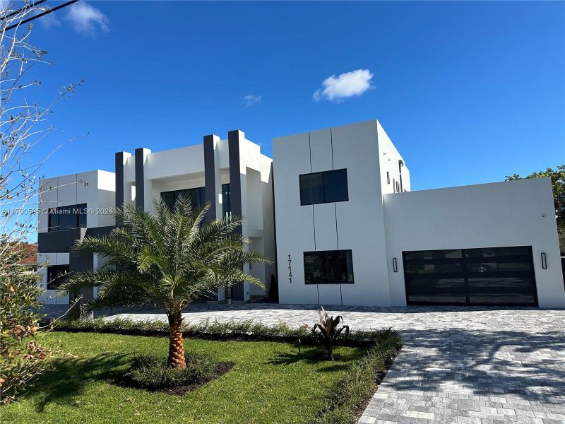 Beautiful modern, cement construction, cement roof, and full impact windows and doors throughout this magnificent home.