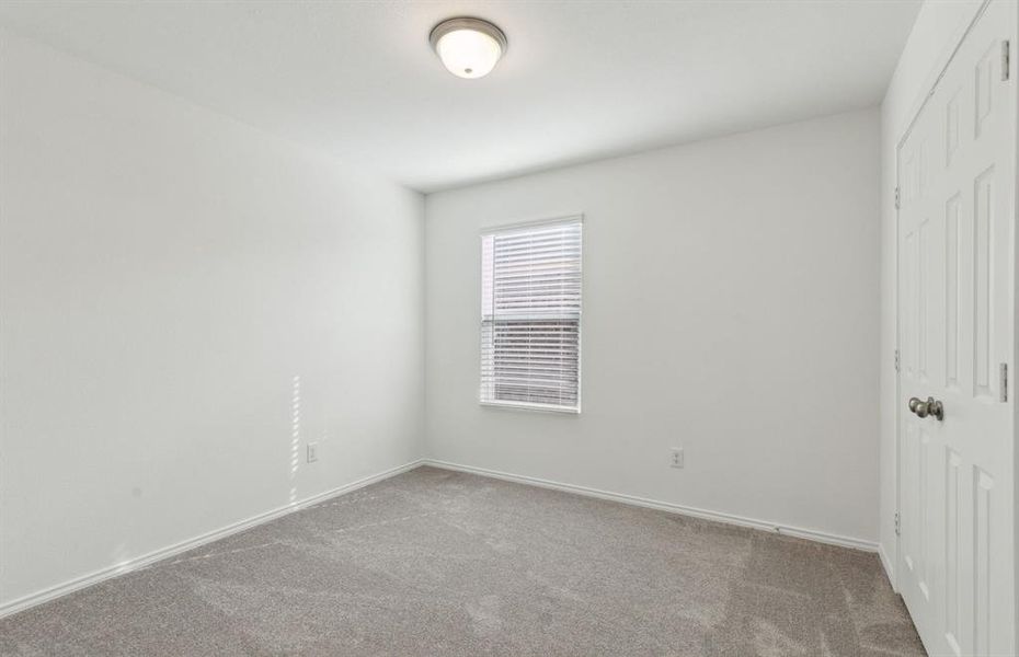 Spacious secondary bedroom with ample closet space *real home pictured