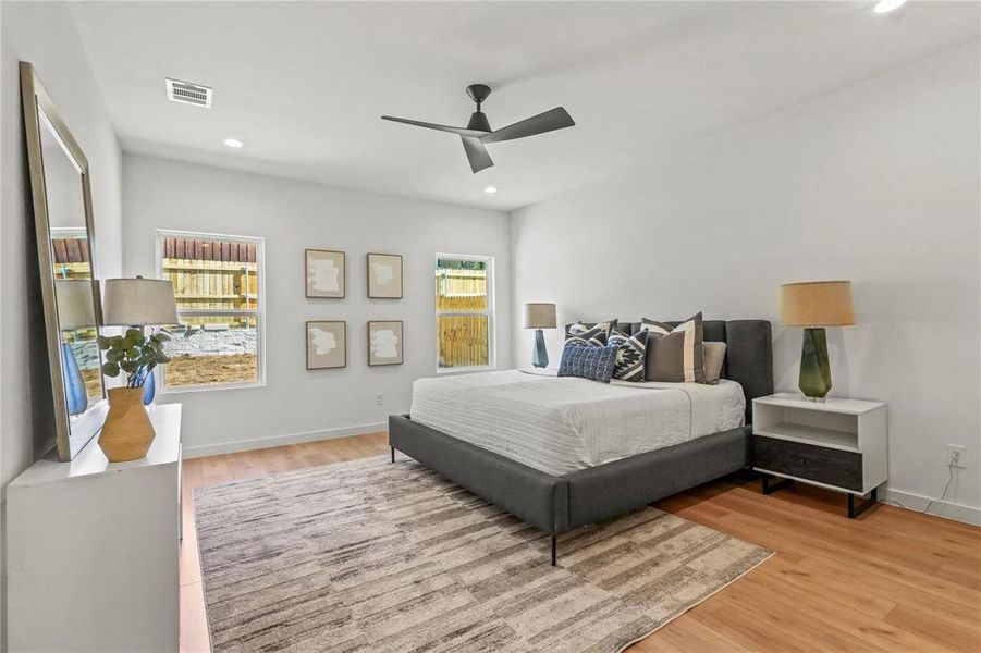 Bedroom featuring light wood-style flooring, recessed lighting, and ceiling fan Bedroom featuring light wood-style flooring, recessed lighting, and ceiling fan