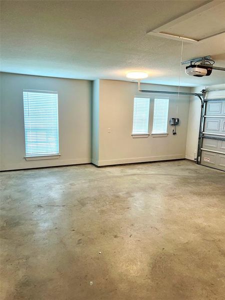 Garage featuring a garage door opener Garage featuring a garage door opener