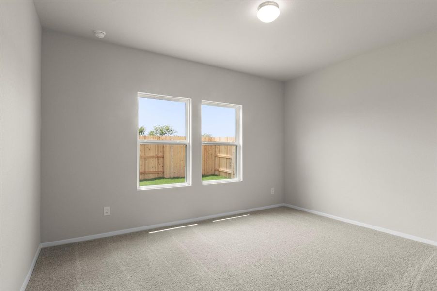 Empty room with carpet floors and baseboards Empty room with carpet floors and baseboards