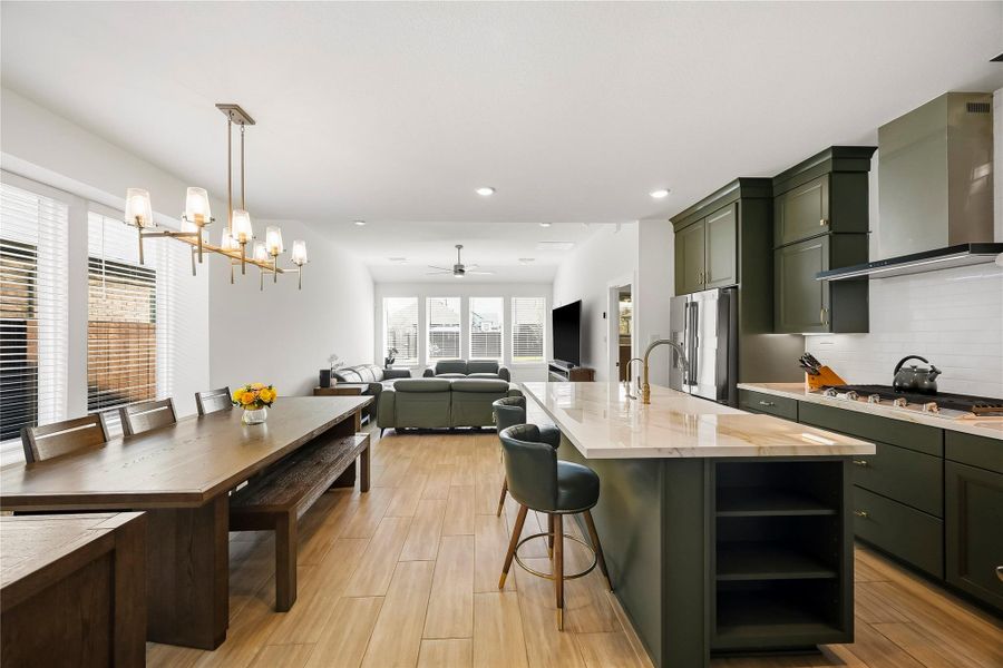 The open-concept kitchen, dining, and family room come together beautifully, creating a comfortable, connected space that feels just right for everything from busy mornings to relaxed evenings at home. The open-concept kitchen, dining, and family room come together beautifully, creating a comfortable, connected space that feels just right for everything from busy mornings to relaxed evenings at home.