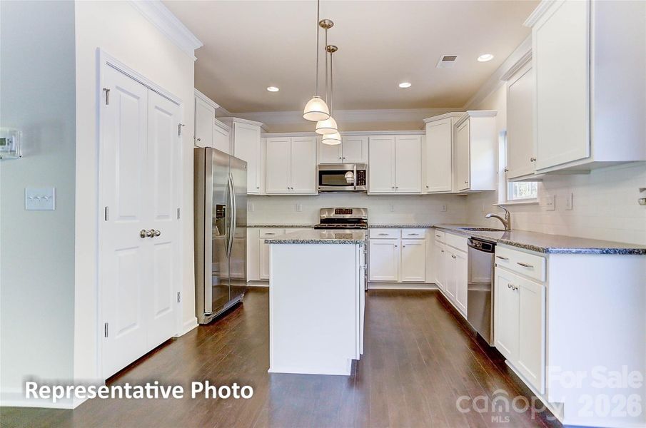 Example of kitchen with gas range and microwave above