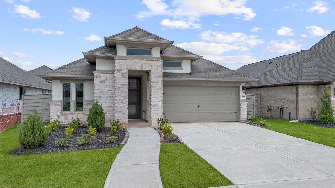 Front exterior of a new home in Pomona 50' & 55', Manvel, TX, highlighting curb appeal (Image 15). Front exterior of a new home in Pomona 50' & 55', Manvel, TX, highlighting curb appeal (Image 15).