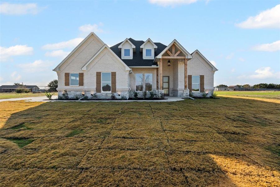 Craftsman-style home with a front yard