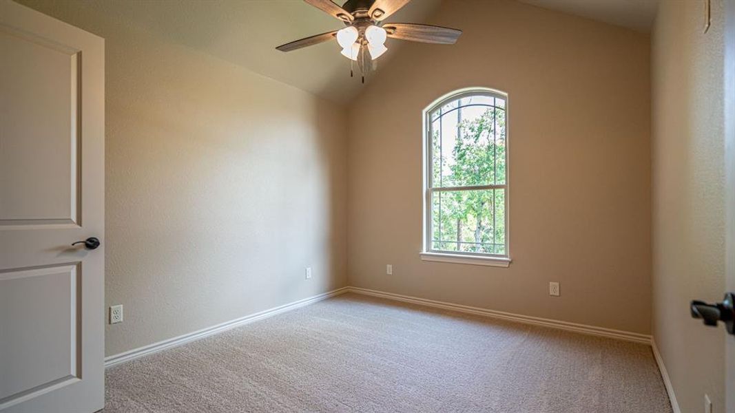 Secondary bedroom with carpet and ceiling fan Secondary bedroom with carpet and ceiling fan