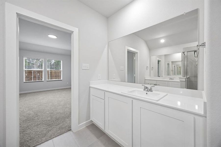 Primary Bathroom in the Heisman home plan by Trophy Signature Homes – REPRESENTATIVE PHOTO