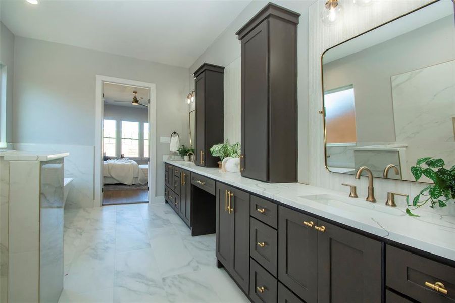 Bathroom featuring ceiling fan and vanity