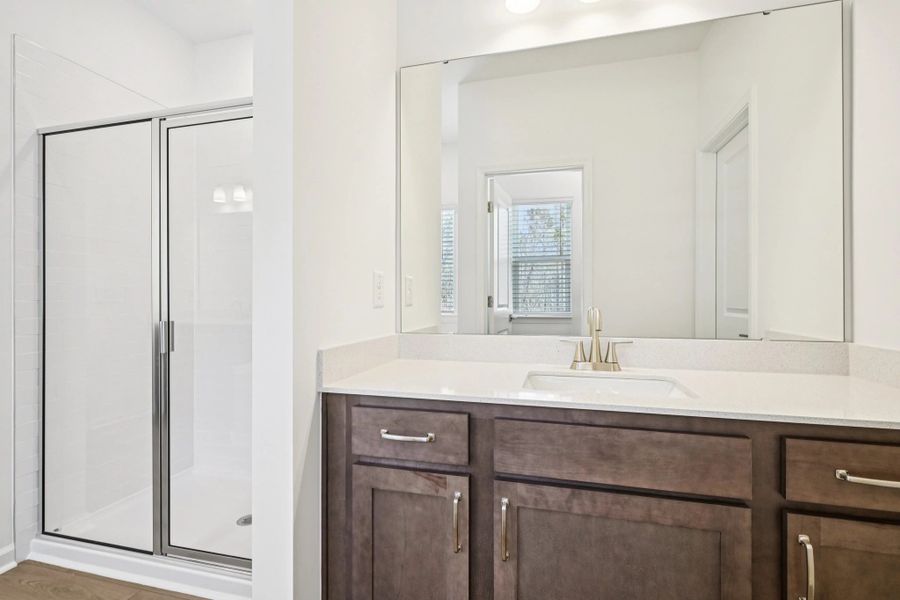 Primary Bath featuring the AW Collection® Roosevelt - Elegant tile and bold hardware finishes.